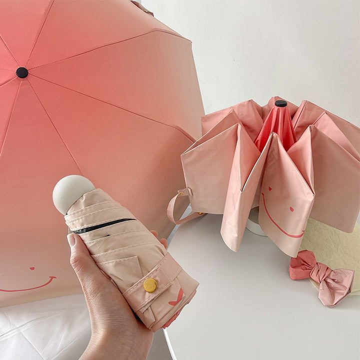 Women's foldable umbrella with playful design and handy wooden handle Bowlift