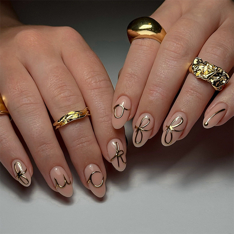 Elegant Press-On Nail Art Set with Stylish Gold Accents Bowlift