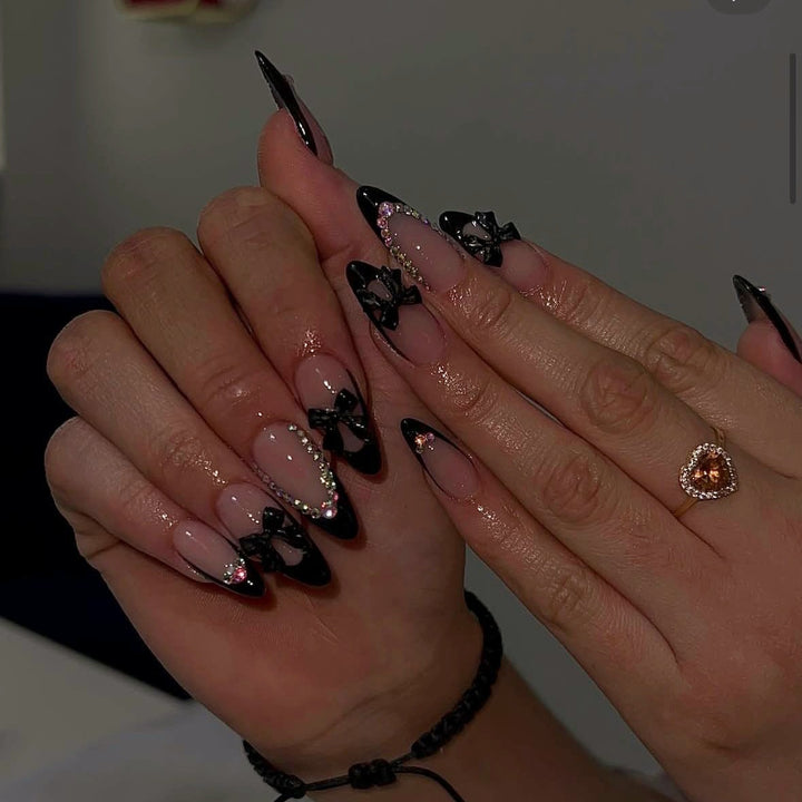 Artificial nail set with glamorous 3D bows and rhinestone embellishments Bowlift