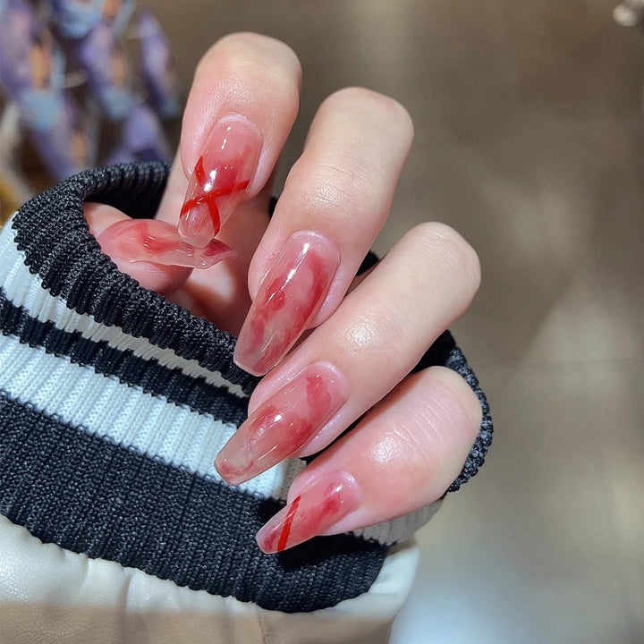 Artfully designed acrylic nails with marbled and decorative effects Bowlift