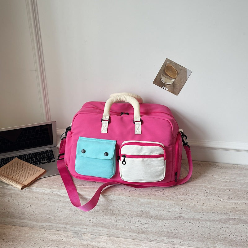 Sporty travel bag with multifunctional outer pockets Bowlift
