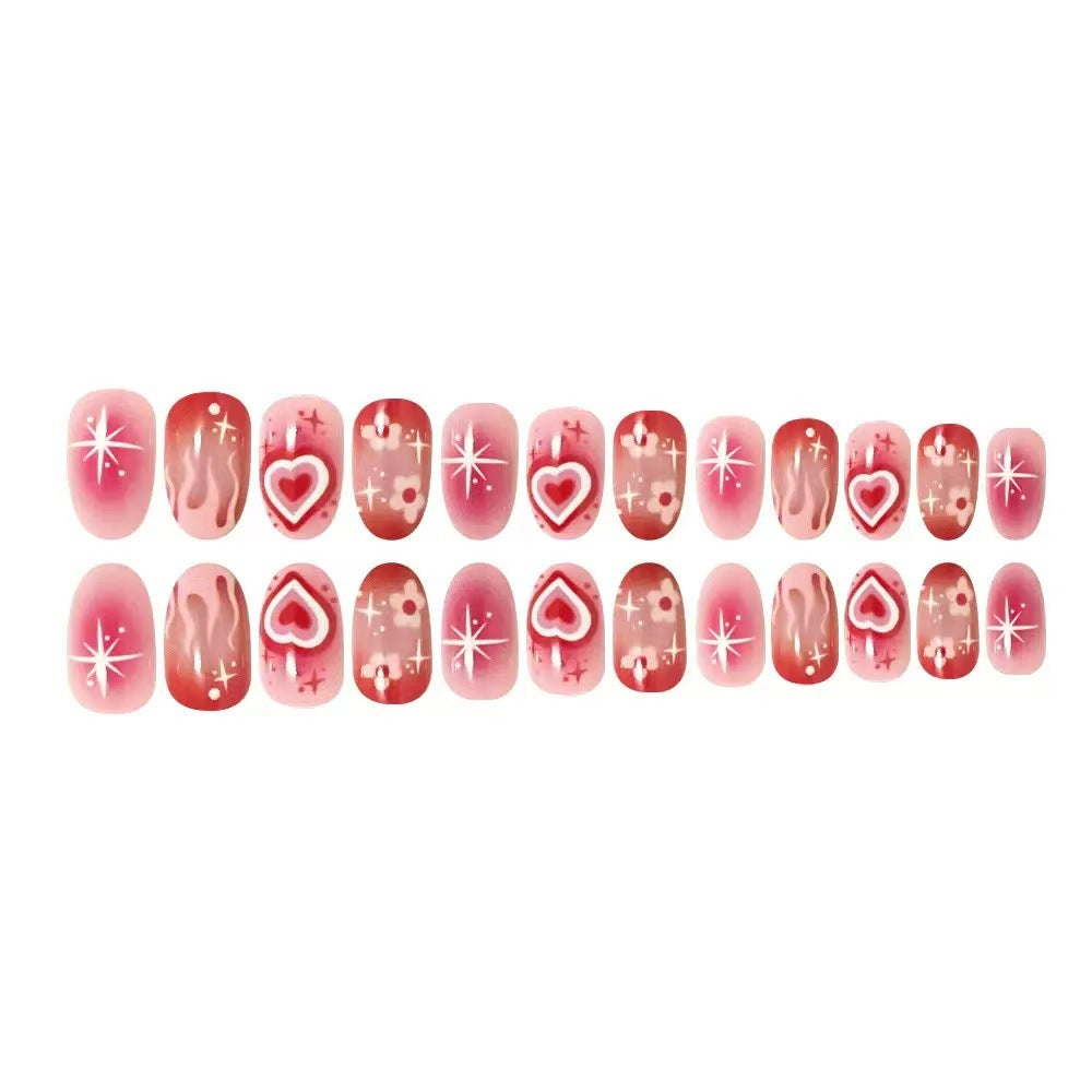 Artificial nail set with romantic heart design and sparkling accents Bowlift