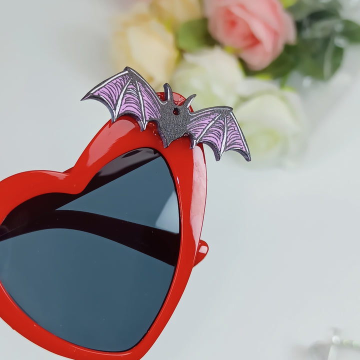 Heart-Shaped Sunglasses with Bat Accents Bowlift