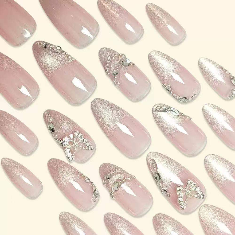 Artistic Stiletto Nail Extensions with Rhinestone Accents Bowlift