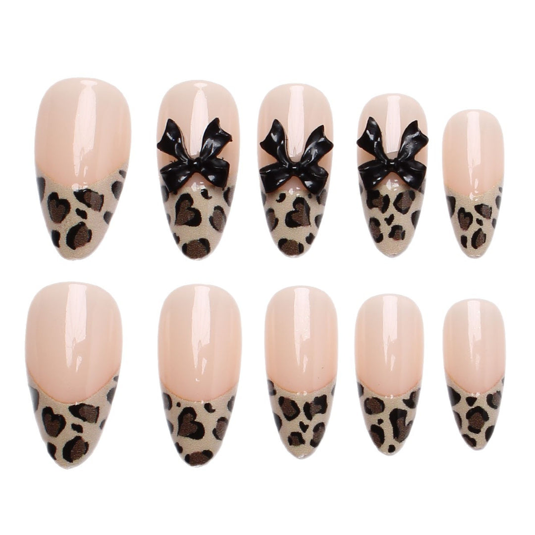 Creative artificial nails with stylish leopard pattern and bow accents Bowlift