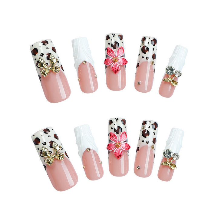 Acrylic nail set with elegant leopard design and floral accents Bowlift