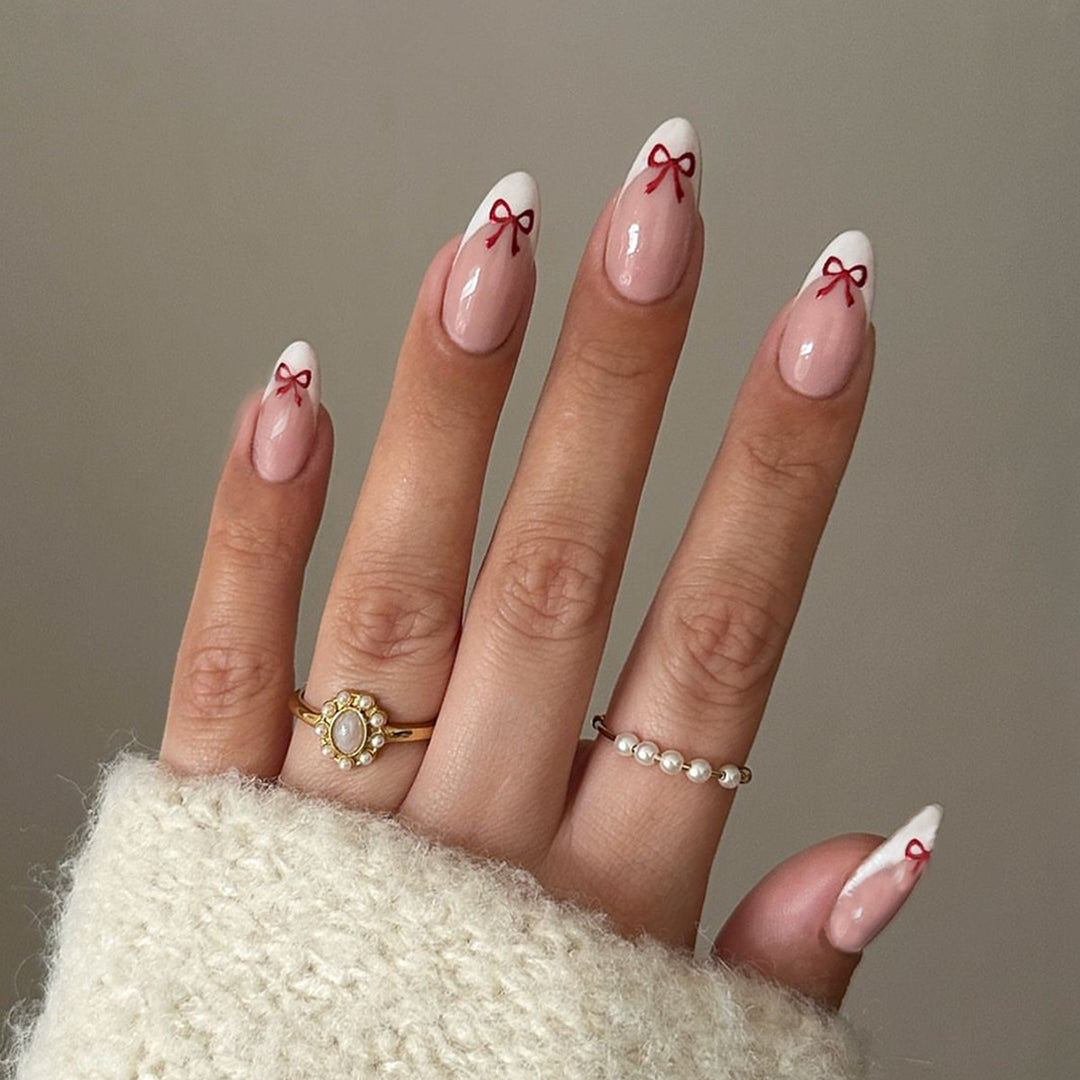 Artificial nail set with playful bow design Bowlift
