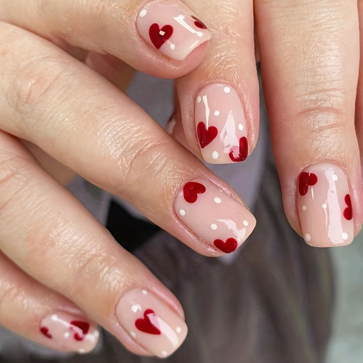 Artificial nail set with romantic heart motifs and shimmering accents Bowlift