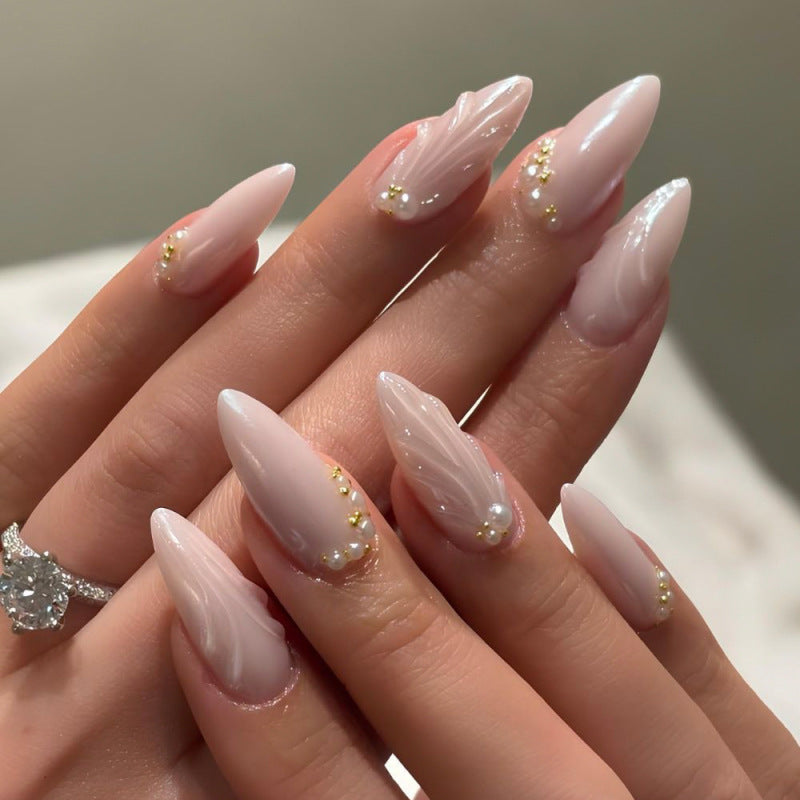 Elegant stiletto nails with shimmer design and pearl decorations Bowlift