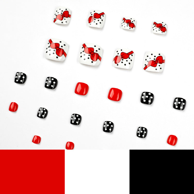 Artful toenail design with elegant bow motifs Bowlift