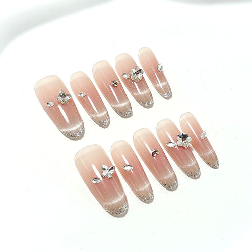 Glamorous artificial nails with rhinestone decorations Bowlift