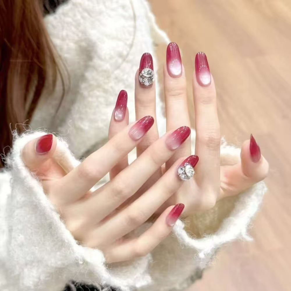 Artificial nails with elegant ombre effect and rhinestone decoration Bowlift