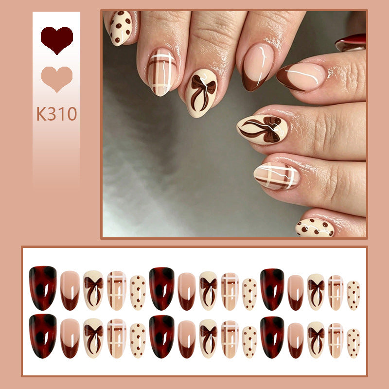 Artificial nail set with elegant bow and caramel designs Bowlift