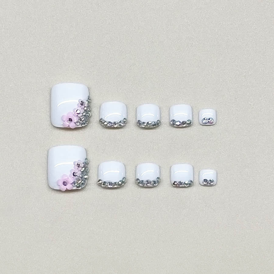 Nail art set with elegant glitter embellishments and floral accents Bowlift