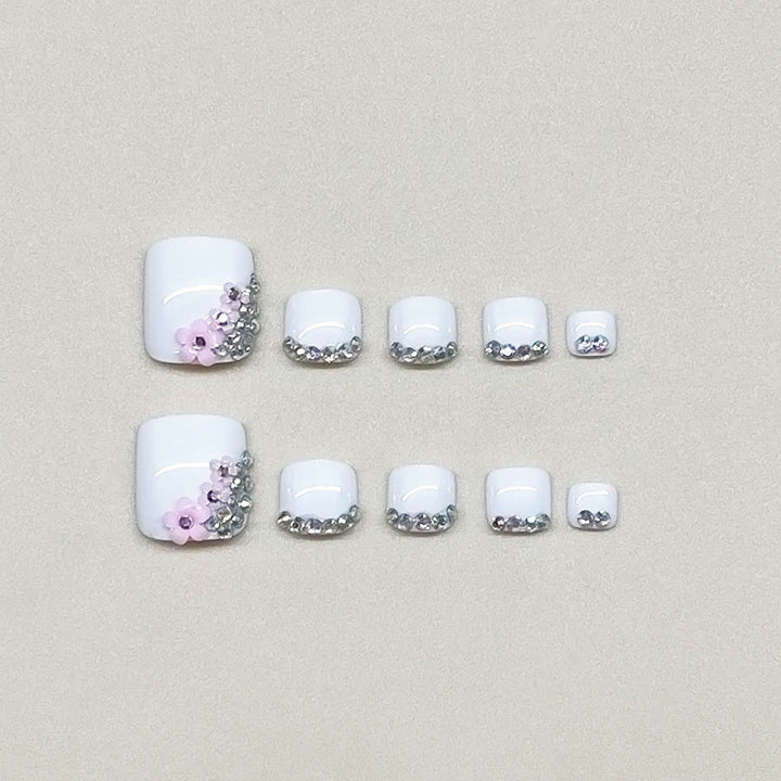 Nail art set with elegant glitter embellishments and floral accents Bowlift
