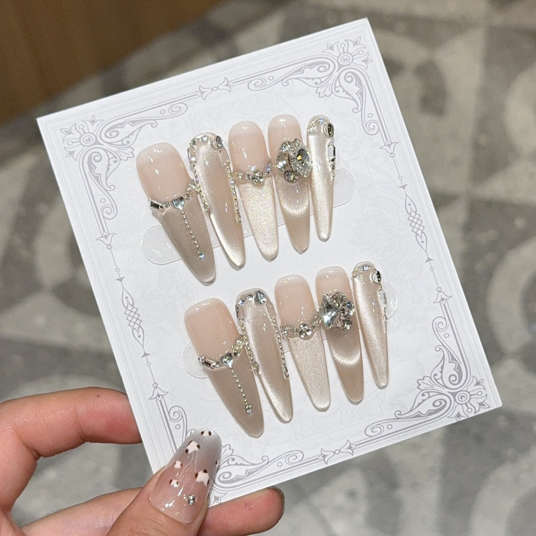 Glamorous nail tips with rhinestone and glitter effects Bowlift