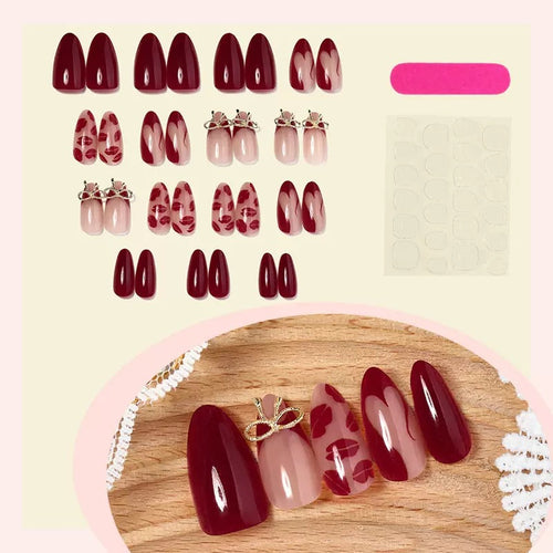 Acrylic nail set with elegant lip motifs and bow decorations Bowlift
