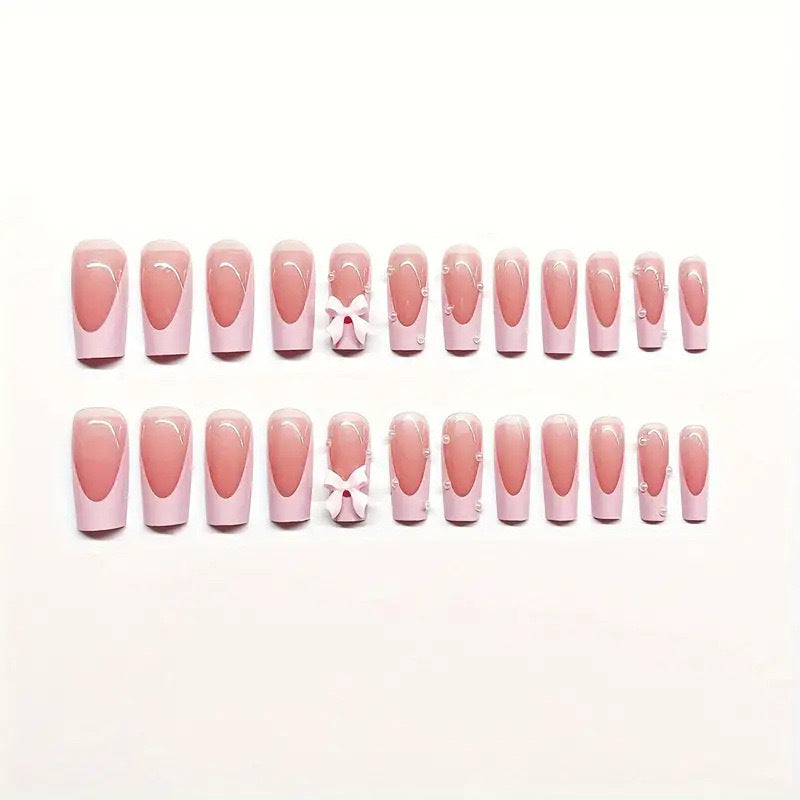 Artificial nail set with romantic bow and glitter details Bowlift