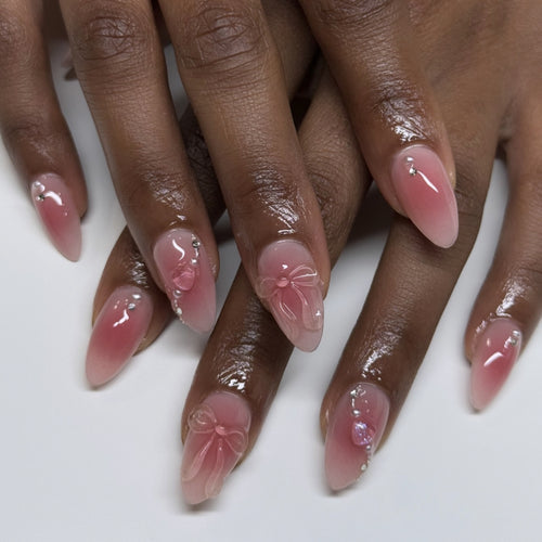 Artful nail extensions with delicate floral accents and glitter Bowlift