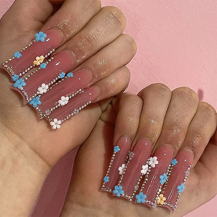Artificial nail set with delicate flower embellishments and glitter accents Bowlift