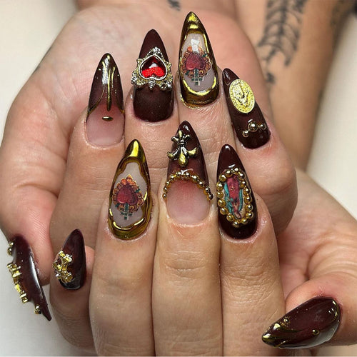 Artistic stiletto nails with detailed embellishments Bowlift