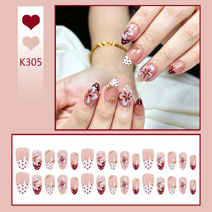 Artificial nail set with floral design and golden accents Bowlift