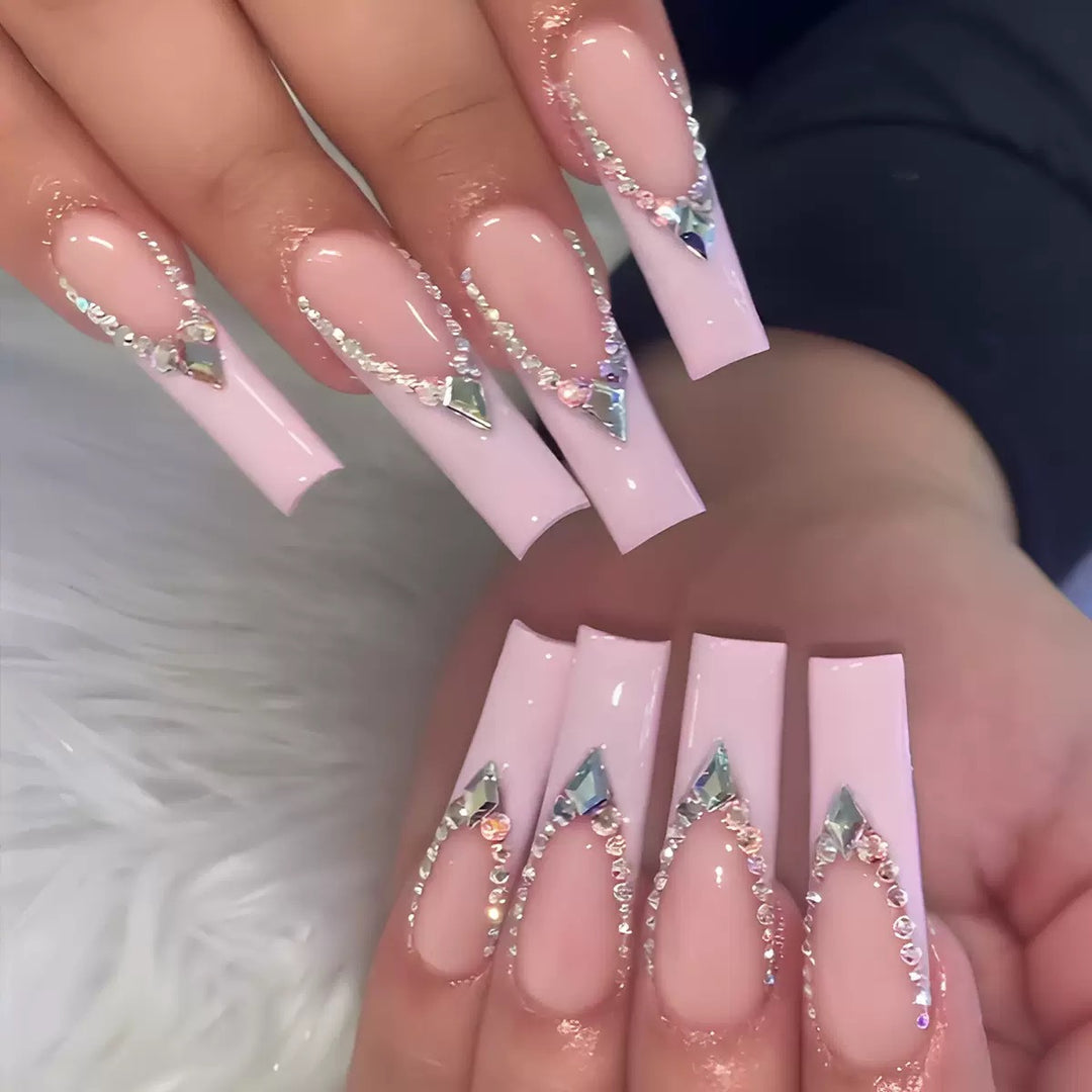 Glamorous artificial nails with sparkling rhinestone embellishments Bowlift
