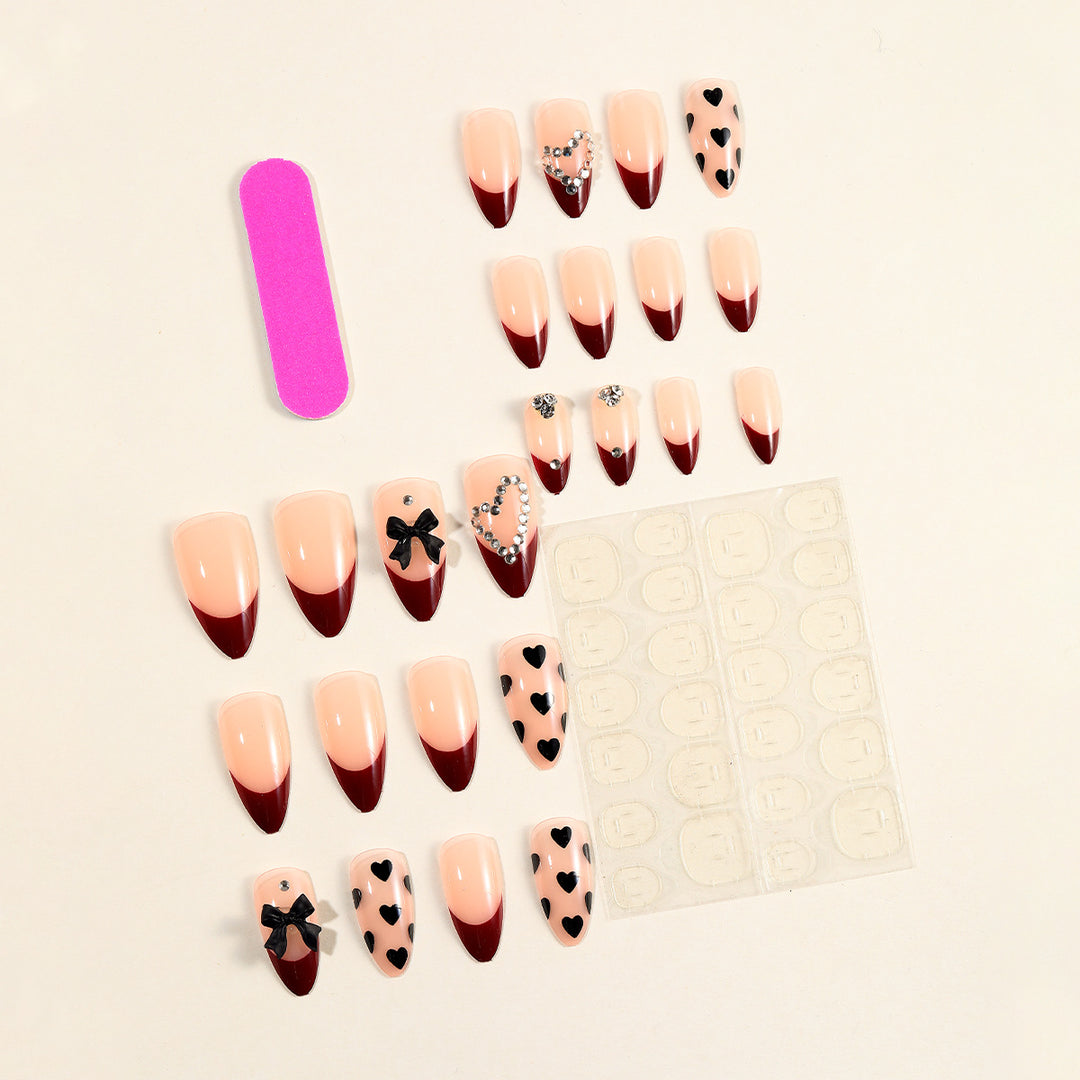 Artistic Stiletto Nail Art Extensions with Heart and Bow Accents Bowlift