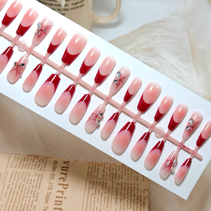 Artificial nails with elegant floral design and glitter accents Bowlift