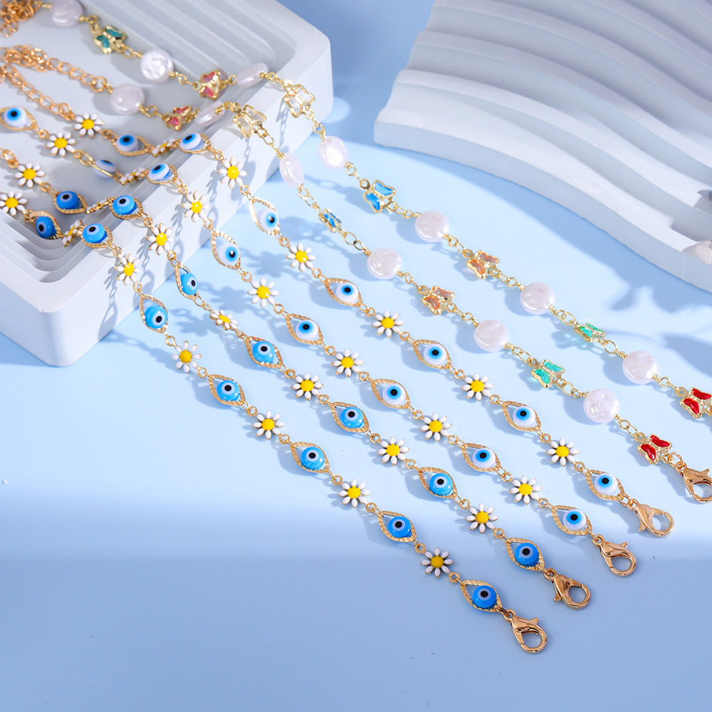 Eye Charm and Daisy Bracelet Bowlift