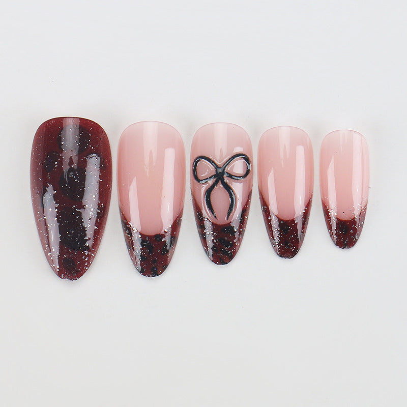 Artistic Stiletto Press-On Nails with Unique Black and Red Design Bowlift