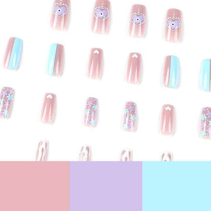 Artful nail art with floral accents and glitter embellishments Bowlift