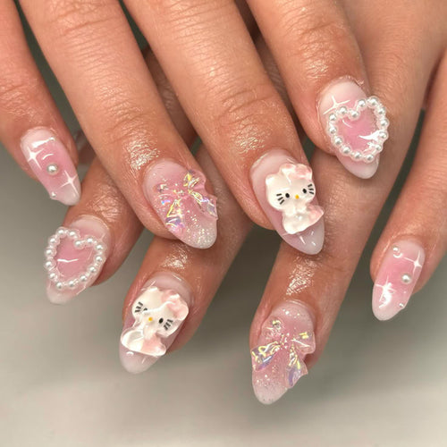 Artificial nail art with playful designs and 3D elements Bowlift