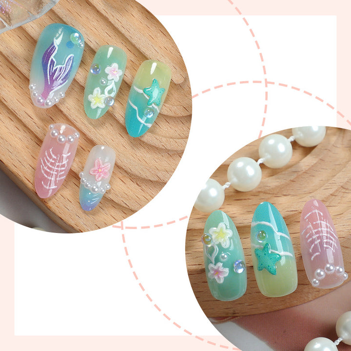Artificial nail set with maritime motifs and floral accents Bowlift