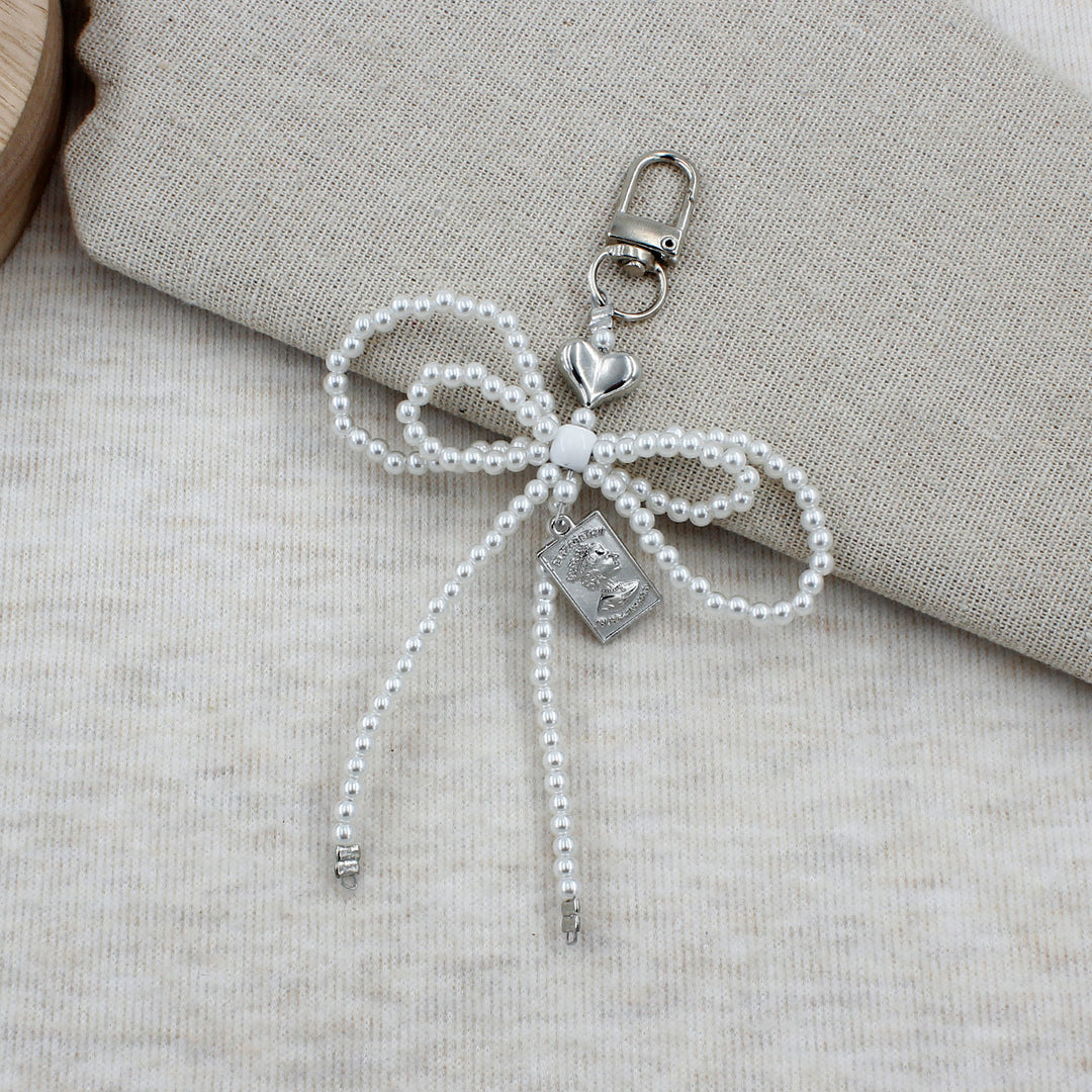 Elegant Beaded Bow Brooch Bowlift