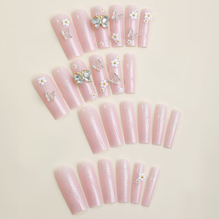 Artificial nail set with floral and glittering accents Bowlift
