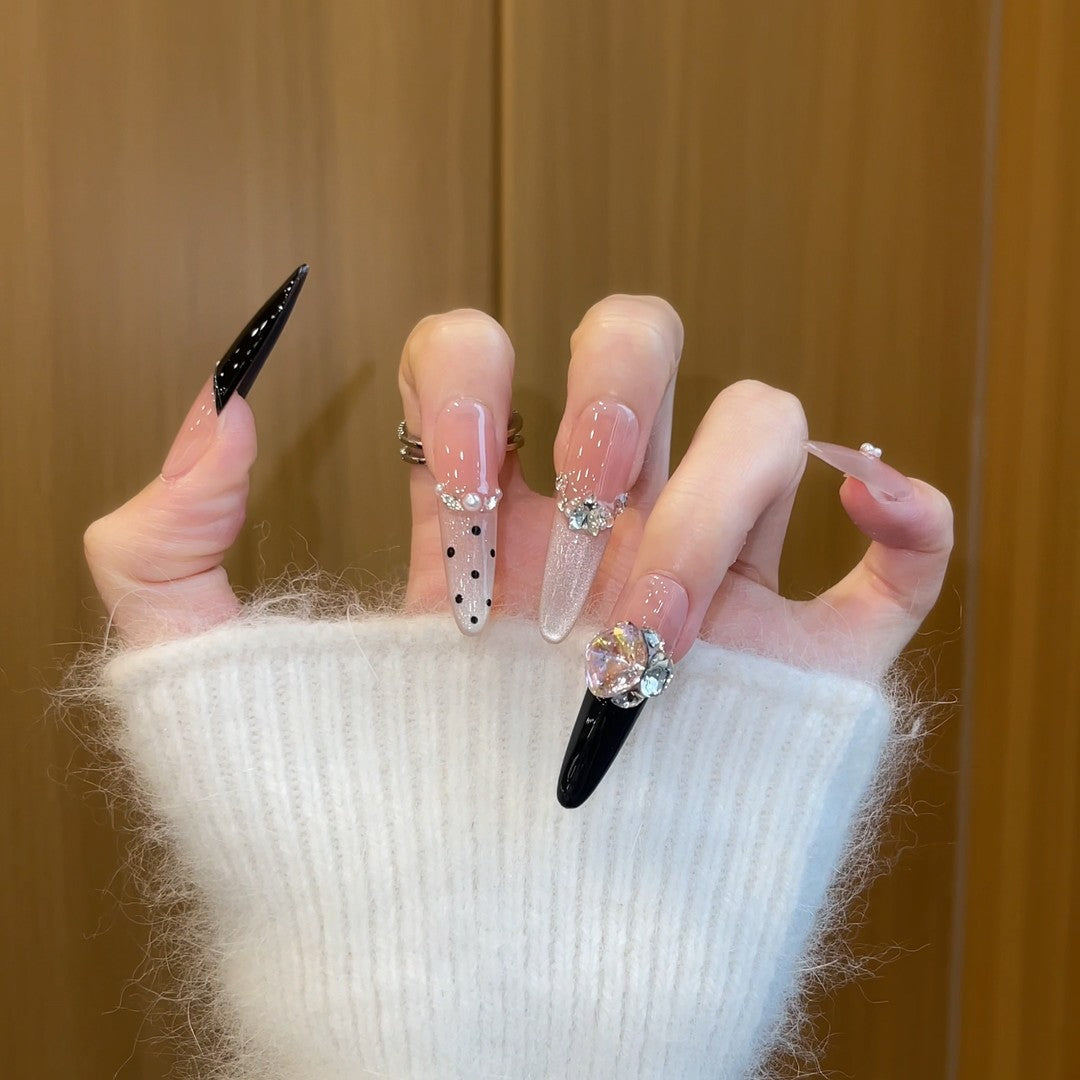 Elegant artificial nails with rhinestone and glitter elements Bowlift