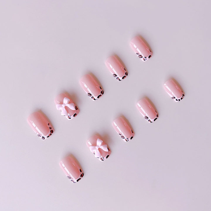 Artificial nail set with elegant leopard design and cute bows Bowlift