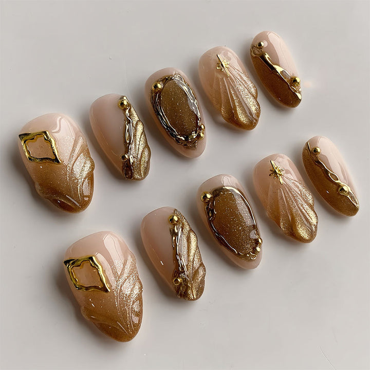 Luxurious Press-On Nail Set with Ornate Gold Detailing Bowlift