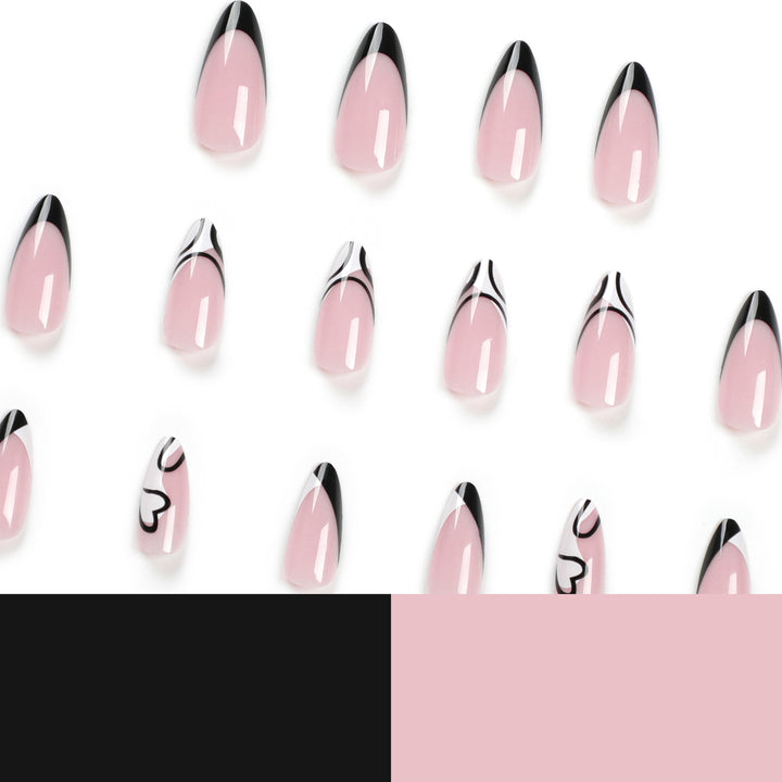 Artful stiletto nails with elegant black-and-white design Bowlift