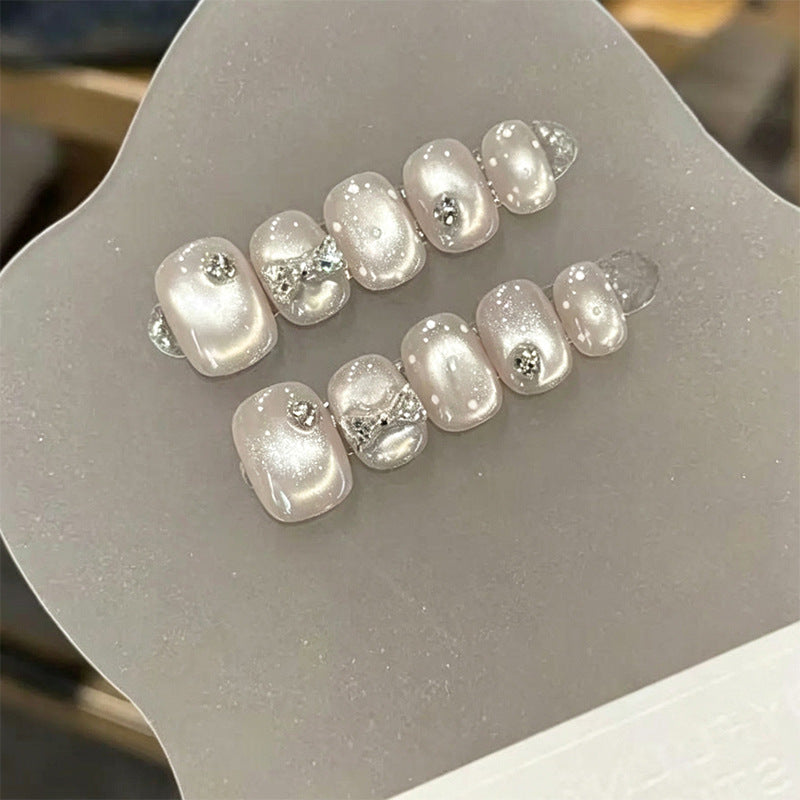 Artificial nail set with elegant glitter and crystal decorations Bowlift