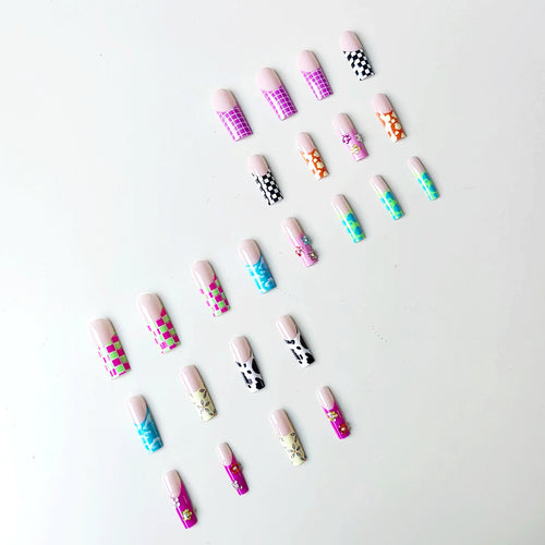 Nail art set with creative designs and shimmering accents Bowlift