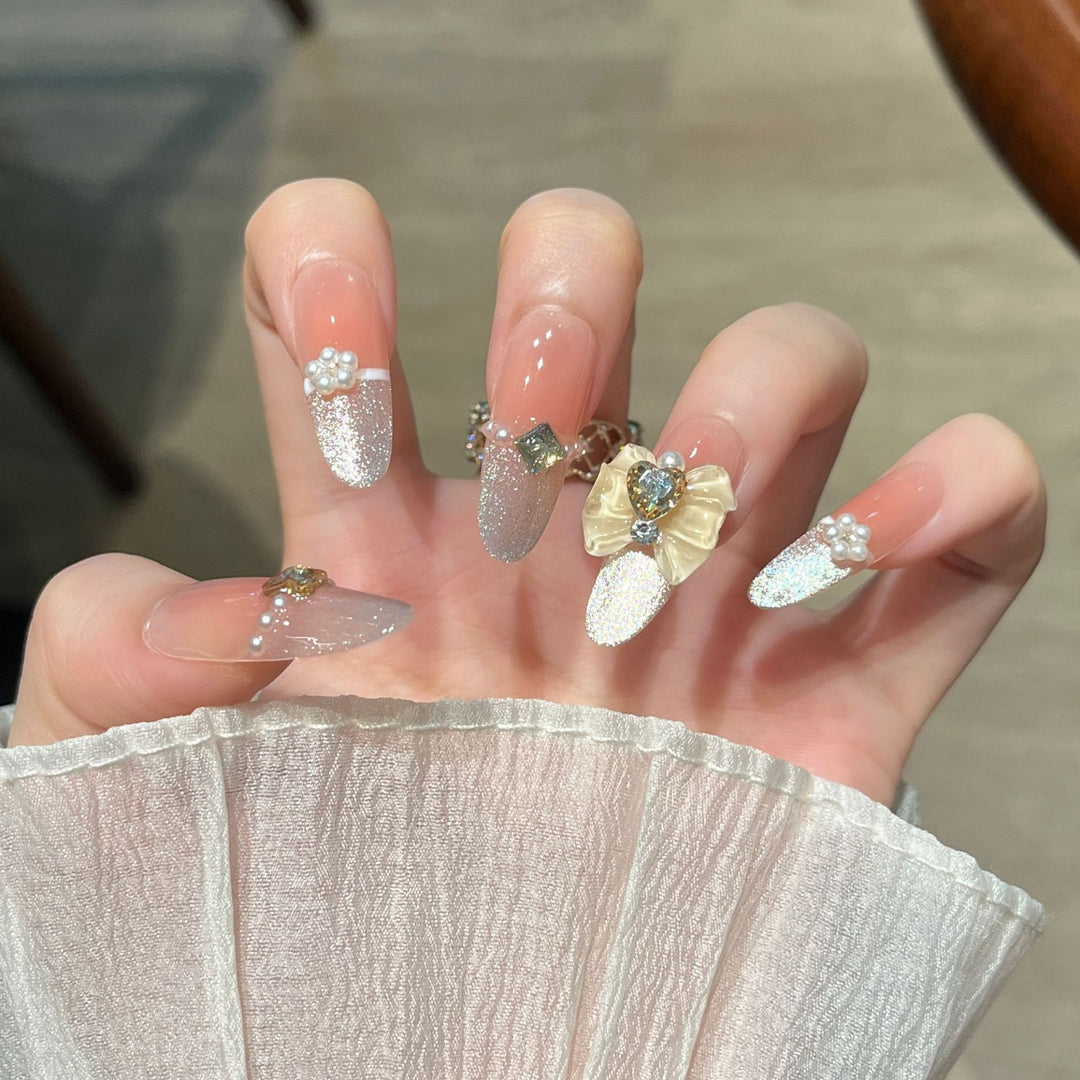 Elegant Nail Art Extensions with Pearl Accents Bowlift
