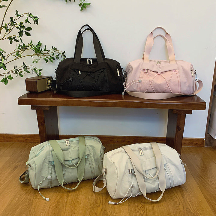 Sporty shoulder bag with adjustable carrying handles and breathable mesh material Bowlift
