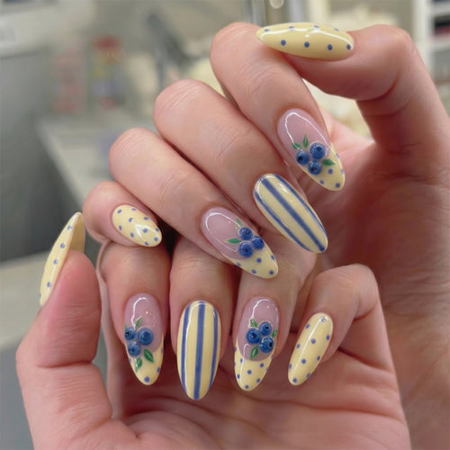 Artful stiletto nails with floral accents and colorful patterns Bowlift