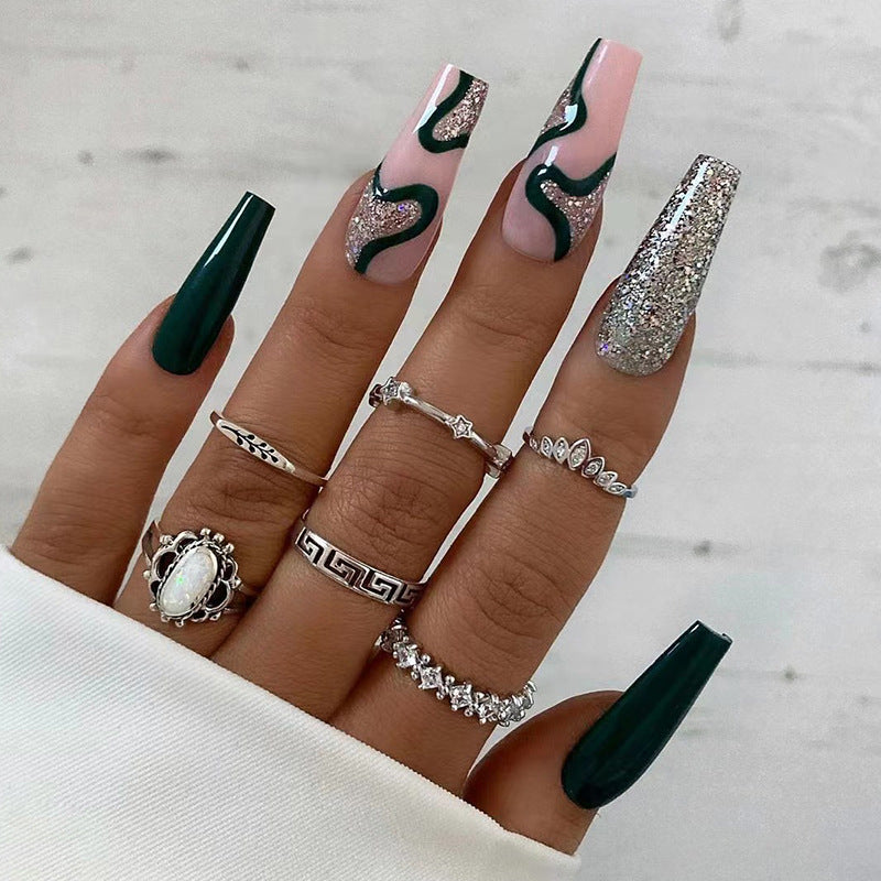 Artificial nail art with elegant glitter and gradient effects Bowlift