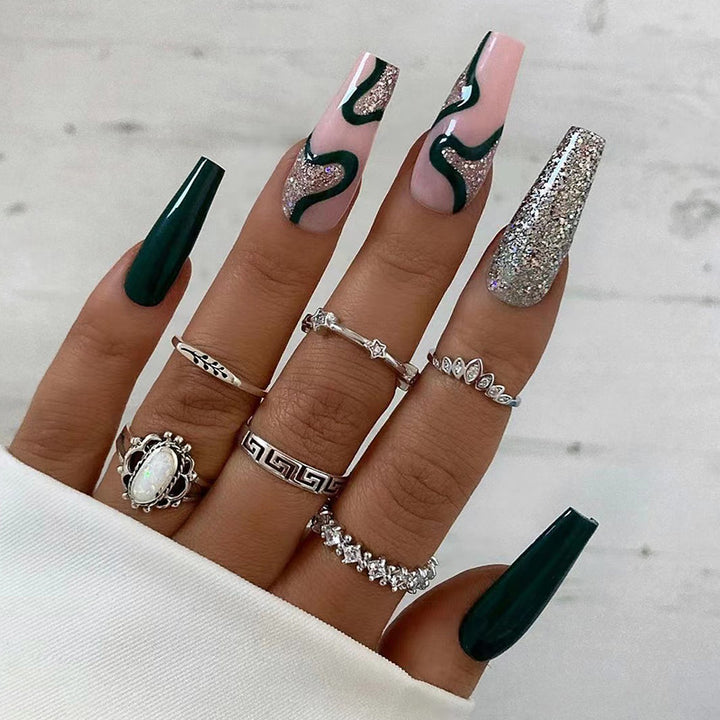 Artificial nail art with elegant glitter and gradient effects Bowlift