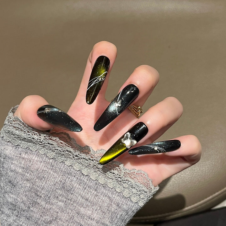 Artistic Stiletto Nail Extensions with Metallic Accents Bowlift