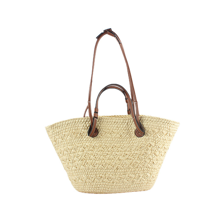 Elegant handbag made of woven natural material with sturdy leather handles Bowlift