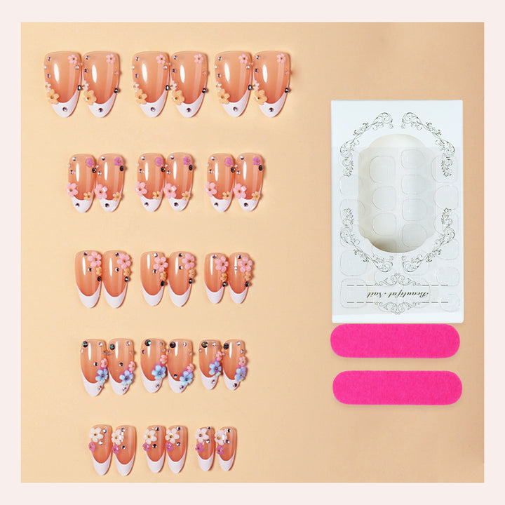 Artificial nail set with delicate floral decorations and sparkling rhinestones Bowlift